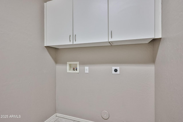 washroom featuring gas dryer hookup, hookup for a washing machine, electric dryer hookup, baseboards, and cabinet space