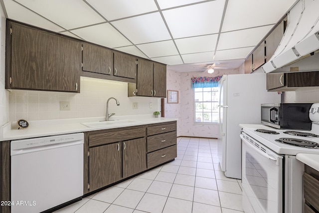 kitchen with a paneled ceiling, white appliances, extractor fan, ceiling fan, and sink