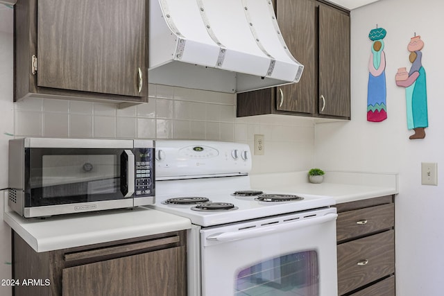 kitchen featuring decorative backsplash, electric range, dark brown cabinets, and extractor fan