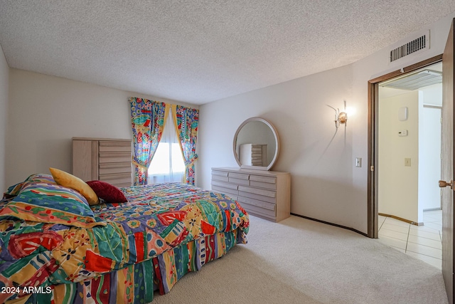 bedroom with carpet and a textured ceiling