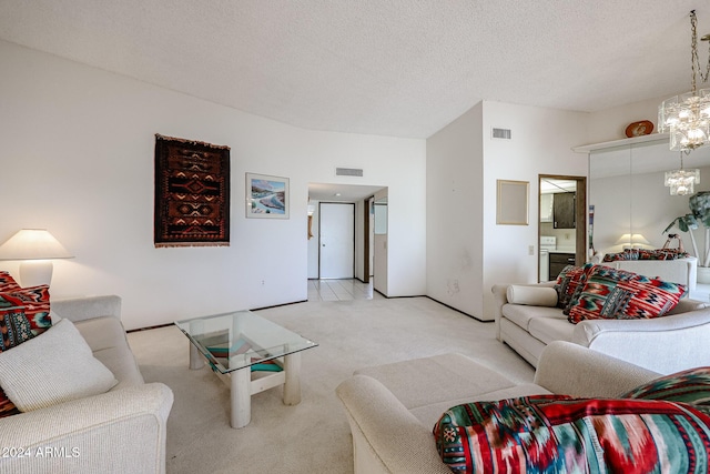 carpeted living room featuring a textured ceiling and a chandelier