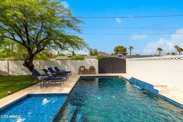 view of swimming pool featuring a patio area