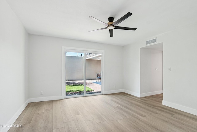 6629 N Majorca Way E, Phoenix, AZ 85016 - unfurnished room with light wood finished floors, a ceiling fan, and baseboards