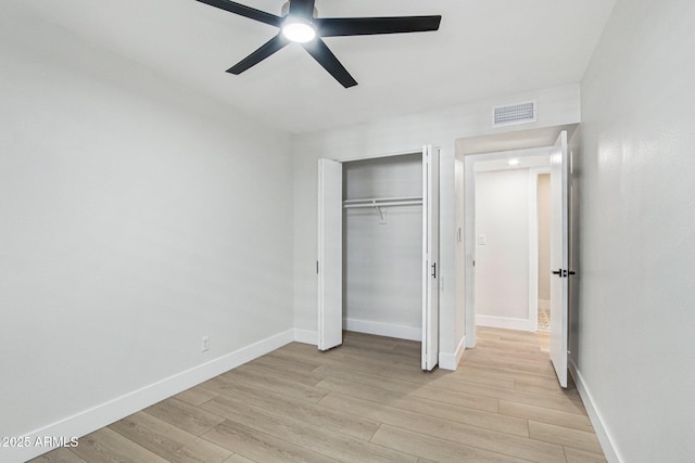 6629 N Majorca Way E, Phoenix, AZ 85016 - unfurnished bedroom with baseboards, light wood finished floors, a closet, and ceiling fan