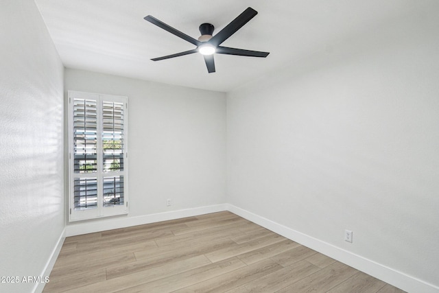 6629 N Majorca Way E, Phoenix, AZ 85016 - spare room with ceiling fan, light wood finished floors, and baseboards