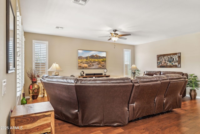 33305 N 26th Ave, Phoenix, AZ 85085 - living area with ceiling fan and dark wood-type flooring