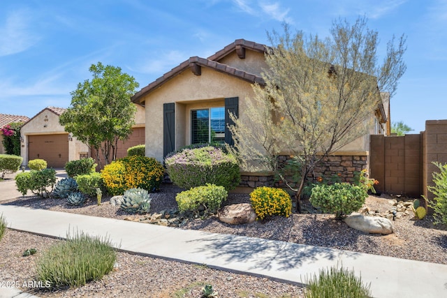 33305 N 26th Ave, Phoenix, AZ 85085 - view of front of house with stucco siding, an attached garage, and a tiled roof