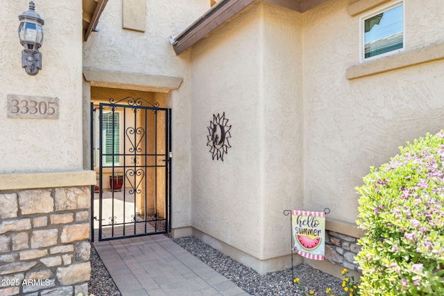 33305 N 26th Ave, Phoenix, AZ 85085 - property entrance with stucco siding and a gate