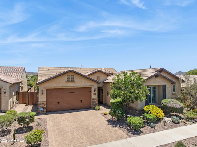 33305 N 26th Ave, Phoenix, AZ 85085 - single story home with a gate, stucco siding, and stone siding