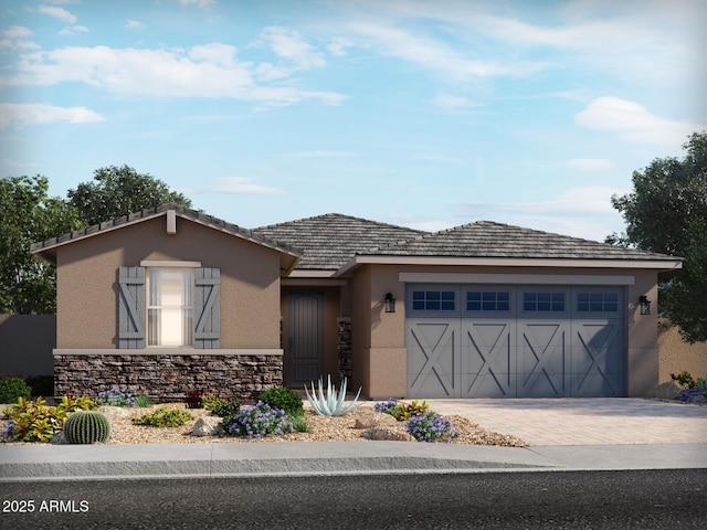 view of front of house featuring driveway, stone siding, a garage, and stucco siding