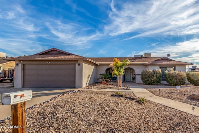 ranch-style home featuring a garage