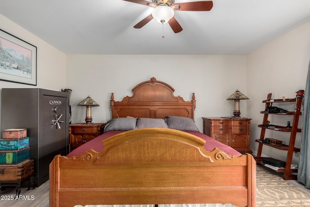 bedroom with light hardwood / wood-style floors and ceiling fan