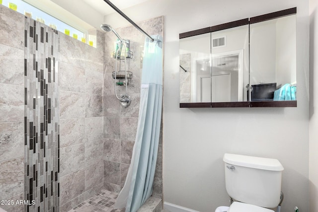 bathroom with toilet and curtained shower