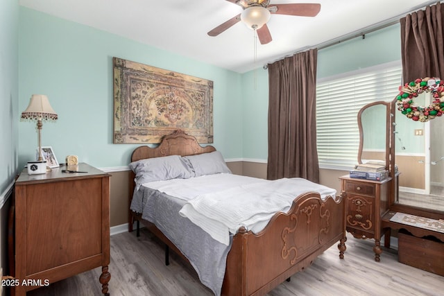 bedroom featuring ceiling fan and light hardwood / wood-style flooring