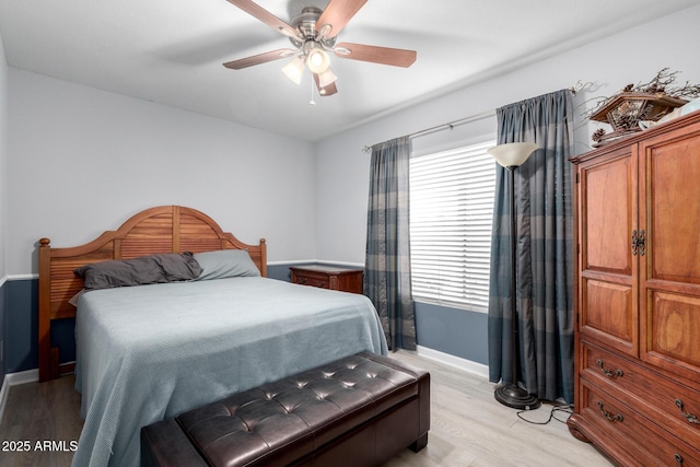 bedroom featuring ceiling fan and light wood-type flooring