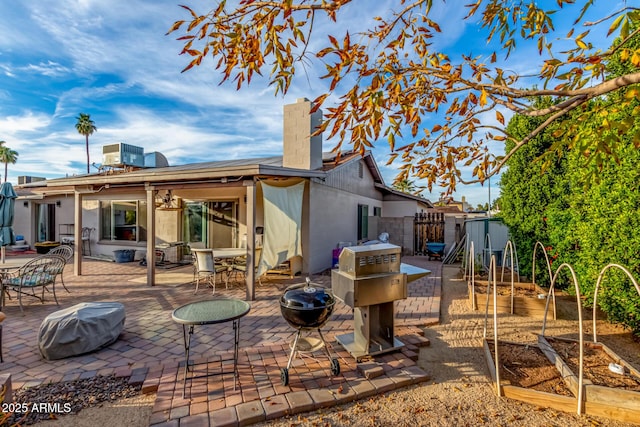 back of house with central AC and a patio area