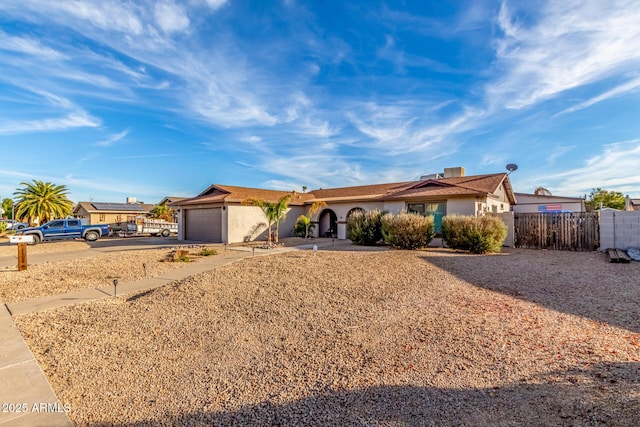 ranch-style home with a garage