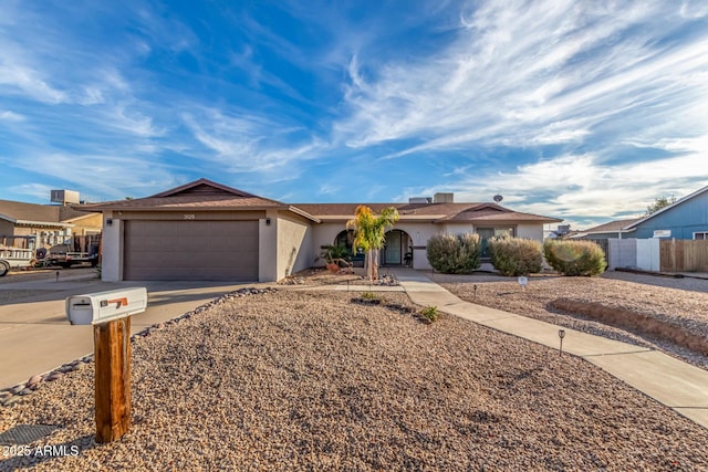 ranch-style home featuring a garage