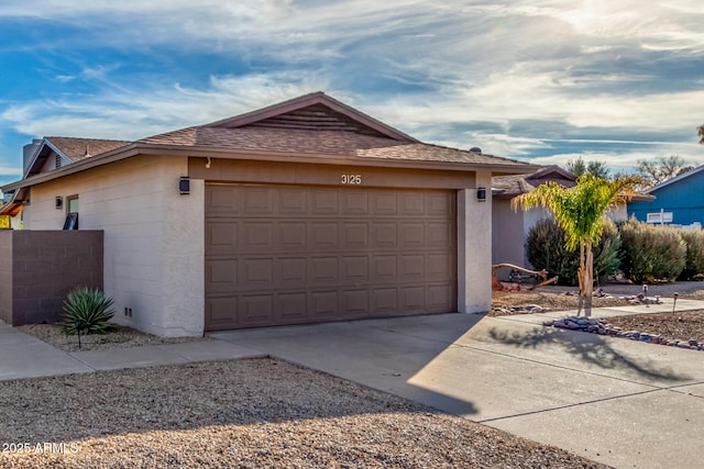 view of front of property with a garage