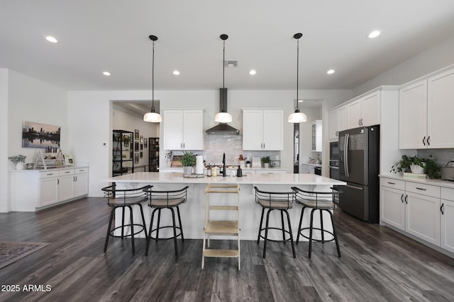 20510 W White Rock Rd, Buckeye, AZ 85396 - kitchen with freestanding refrigerator, wall chimney range hood, tasteful backsplash, light countertops, and dark wood-style floors