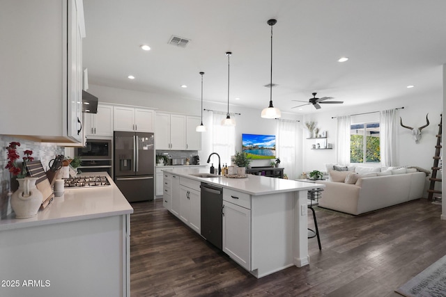20510 W White Rock Rd, Buckeye, AZ 85396 - kitchen featuring appliances with stainless steel finishes, a sink, ceiling fan, white cabinetry, and open floor plan