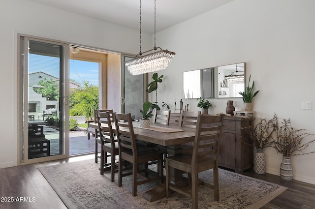 20510 W White Rock Rd, Buckeye, AZ 85396 - dining room featuring wood finished floors, baseboards, and a chandelier