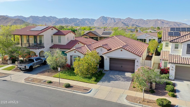 20510 W White Rock Rd, Buckeye, AZ 85396 - mediterranean / spanish-style home featuring a residential view, a mountain view, driveway, and an attached garage