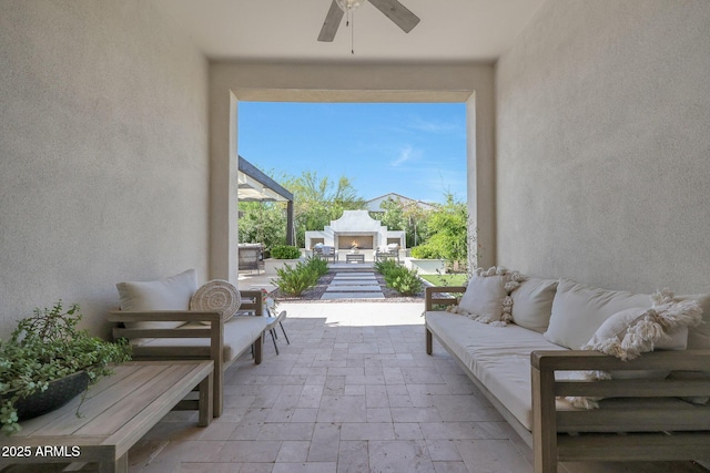 20510 W White Rock Rd, Buckeye, AZ 85396 - view of patio featuring an outdoor living space with a fireplace and a ceiling fan