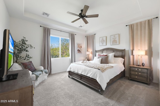 20510 W White Rock Rd, Buckeye, AZ 85396 - bedroom featuring a tray ceiling, carpet floors, baseboards, and a ceiling fan