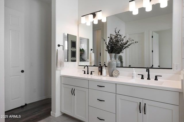 20510 W White Rock Rd, Buckeye, AZ 85396 - full bath featuring double vanity, baseboards, and wood finished floors