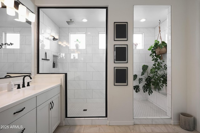 20510 W White Rock Rd, Buckeye, AZ 85396 - bathroom with healthy amount of natural light, vanity, a shower stall, and baseboards