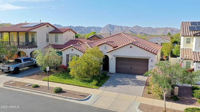 20510 W White Rock Rd, Buckeye, AZ 85396 - mediterranean / spanish house featuring stucco siding, a mountain view, driveway, and a garage