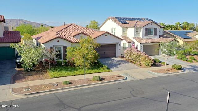 20510 W White Rock Rd, Buckeye, AZ 85396 - mediterranean / spanish-style house with driveway, stucco siding, a tiled roof, and a garage