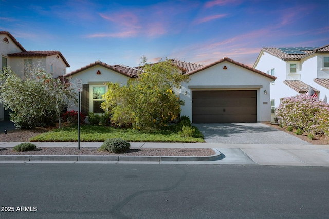 20510 W White Rock Rd, Buckeye, AZ 85396 - mediterranean / spanish house featuring stucco siding, a garage, driveway, and a tiled roof