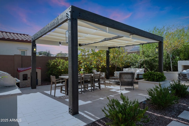 20510 W White Rock Rd, Buckeye, AZ 85396 - patio terrace at dusk featuring outdoor lounge area, outdoor dining area, and a patio area