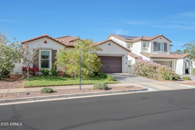 20510 W White Rock Rd, Buckeye, AZ 85396 - mediterranean / spanish home with driveway, a tile roof, stucco siding, and an attached garage