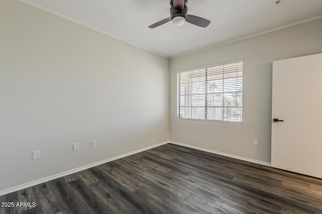 empty room featuring crown molding, a ceiling fan, dark wood-style flooring, and baseboards