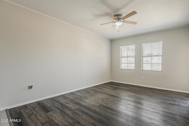 empty room with baseboards, ceiling fan, ornamental molding, and dark wood-type flooring
