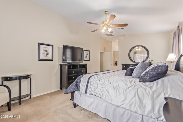 bedroom featuring visible vents, baseboards, a ceiling fan, carpet floors, and vaulted ceiling