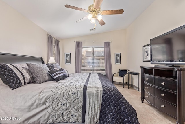 bedroom featuring a ceiling fan, vaulted ceiling, and light colored carpet