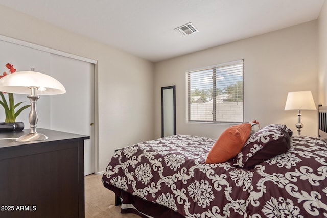 bedroom featuring a closet and visible vents