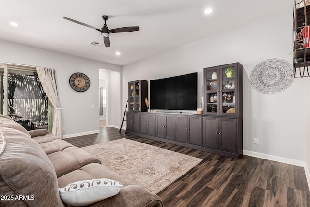 living room with dark wood-type flooring, recessed lighting, and a ceiling fan