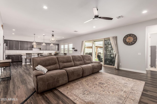 living room with dark wood-type flooring, recessed lighting, and ceiling fan