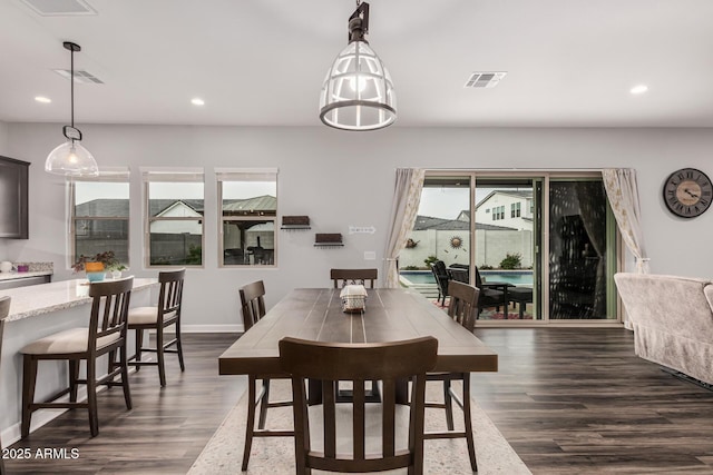 dining space featuring dark wood-style floors, visible vents, and recessed lighting