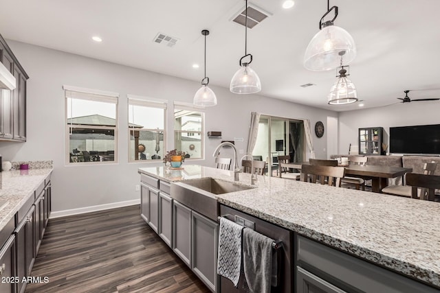 kitchen featuring visible vents, gray cabinetry, recessed lighting, a ceiling fan, and a sink