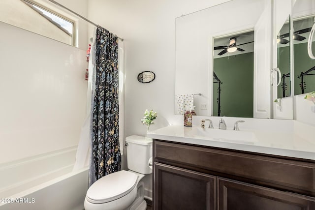 bathroom featuring shower / bath combination with curtain, toilet, vanity, and ceiling fan