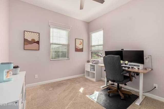 home office with light colored carpet, baseboards, and ceiling fan