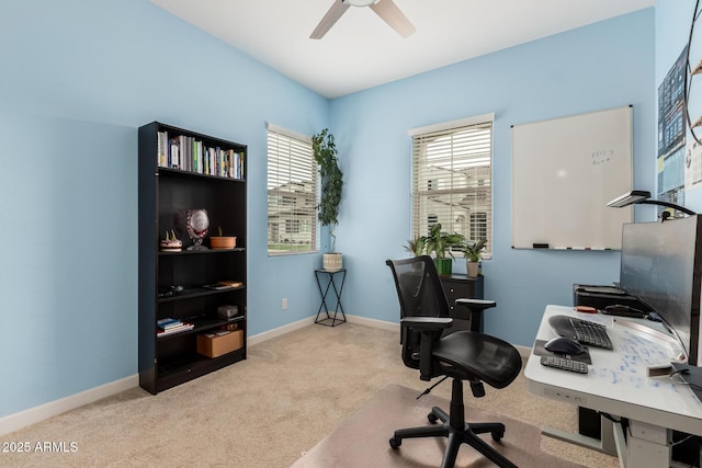 office area featuring baseboards, ceiling fan, and carpet floors