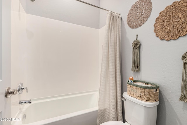 bathroom featuring toilet and shower / bath combo