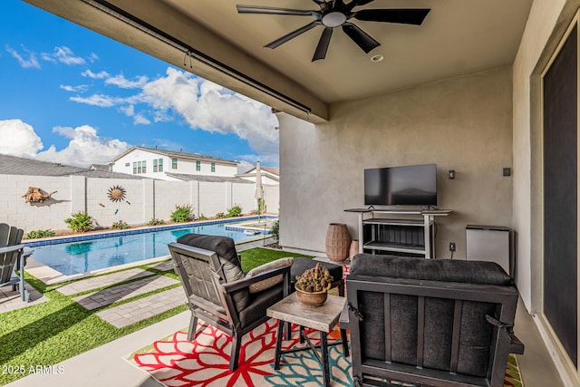 view of patio with a fenced in pool, a ceiling fan, and a fenced backyard